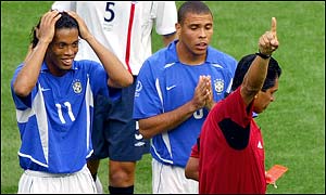 Ronaldinho cannot believe referee Felipe Ramos Rizo has shown him the red card